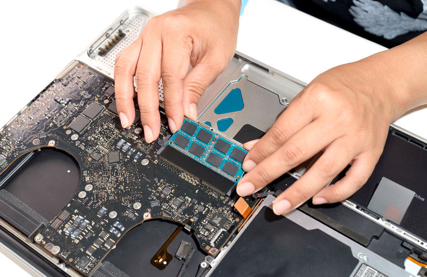 66466805 - technician install upgrade memory for laptop computer